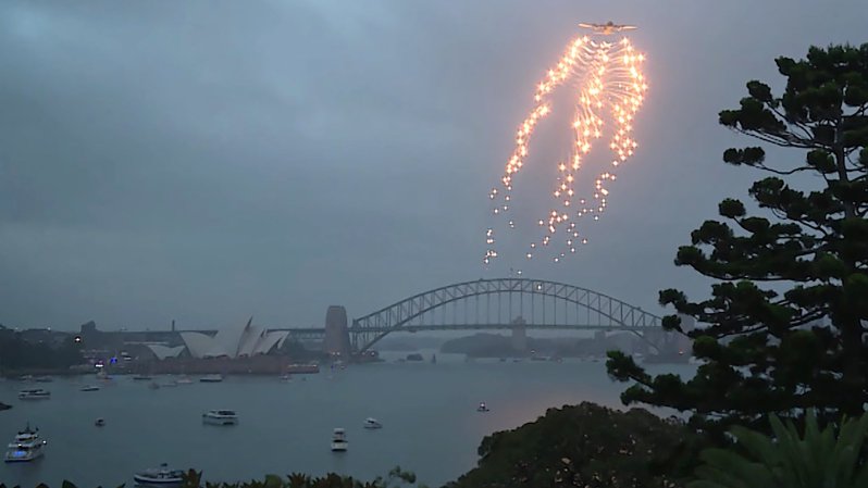 Watch This C-130J Make An Incredible Flare-Popping Musical Flyover Of Sydney For Australia Day (Updated)