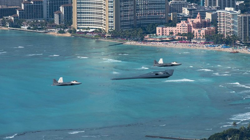 Take In These Gorgeous Photos Of A B-2 And F-22s Soaring Together Over Hawaii